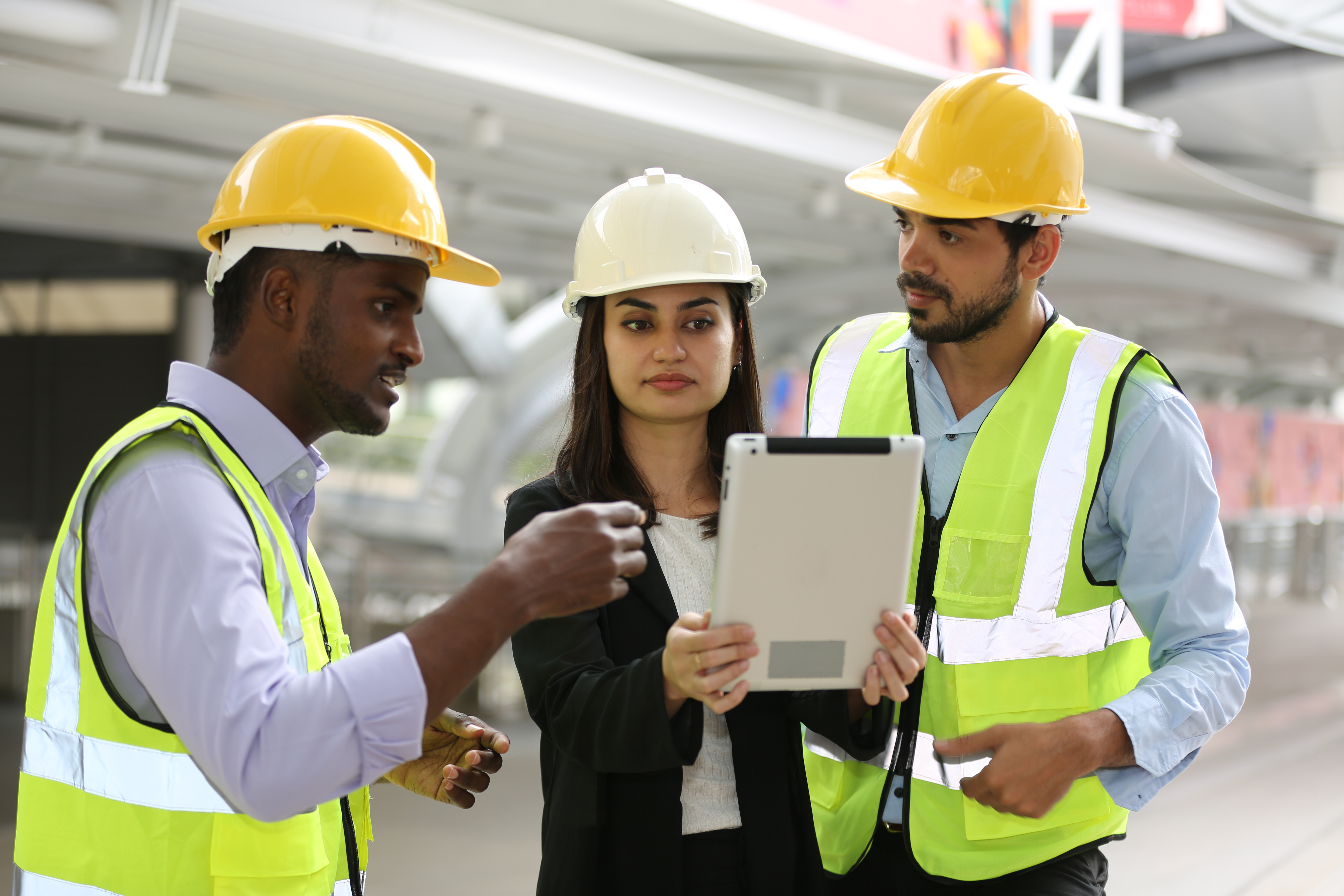 Architect and construction engineer or surveyor discussion plans and blueprints